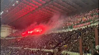 Benfica ultras throwing flares to home fans