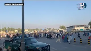 Desperate crowds gather at Kabul airport waiting to leave Afghanistan