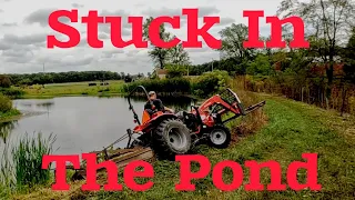 IDIOT gets tractor stuck in the Pond