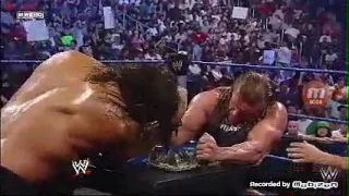 Triple H fights the great kali in a indian broken glass arm wrestling match