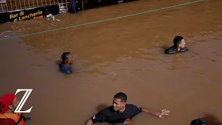 Menschen in Brasilien kämpfen gegen Überflutung