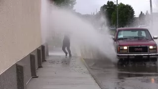 Old man splashed by puddle