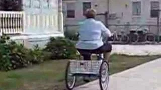 old lady falling off tricycle