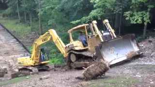 Steep slippery slope for a dozer and excavator