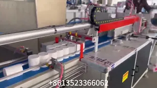 Automatic toilet paper rewinding machine, paper cutter and packaging machine