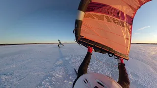 Wing skiing on a frozen lake