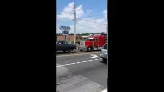 Chevy pick up pulls a broken down tractor trailer out of traffic!