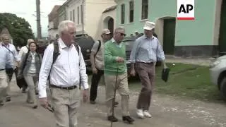 Charles visits village where his foundation plans to open an office