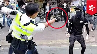 Hong Kong cop shoots protester at point-blank range - TomoNews