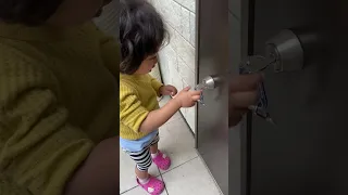 Kid opening the door in the house