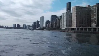 Down the East River surveying the vast City-Scape of Manhattan Island | New York State