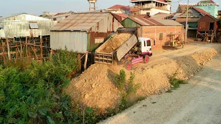 active  almost done In small Project D20pP KOMAT'SU Bulldozer moving Road In Forest With dump Trucks