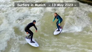 Surfers in Munich City: the "Eisbach wave", English Garden  - 13 May 2023 -