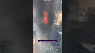 Huge fire engulfs high-rise in China