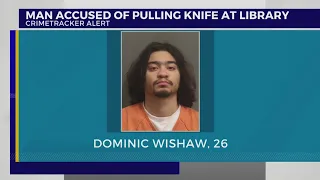 Man charged with pulling knife at library