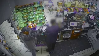 Surveillance video shows armed robbery at Chevron gas station