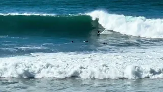 Swamis beach, Encinitas, CA, near San Diego - 12/30/23: Surfers ride 10-14' waves