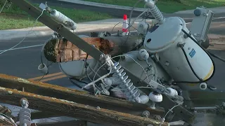 Dump Truck Knocks Powerlines Onto Women