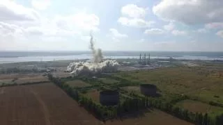 grain power station chimney demolition with sound. drone footage