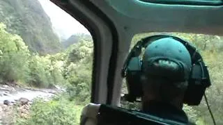 Helicopter landing at Manawaiopuna Falls