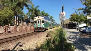 Coaster Cab Car 2301 leads a Southbound Coaster out of Carlsbad Village 10-2-2019