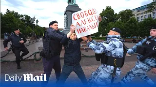 Russian police forcefully detain activists supporting Putin foe Navalny in Moscow