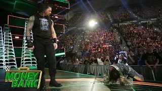 Roman Reigns wrecks Elias on the entrance ramp: WWE Money in the Bank 2019