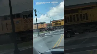 Group narrowly escapes before train hits stuck vehicle