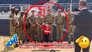 Sweet Little Boy Dressed As King’s guard has a great time chatting with these soldiers.