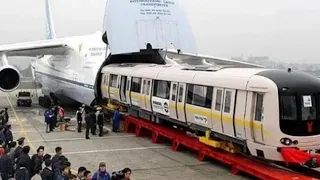 Cargo Airplane Carries train, Helicopter and the Containers