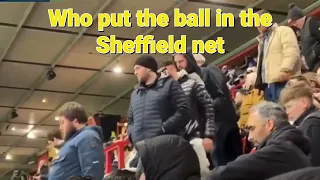 Arsenal fans at Sheffield United. Stadiums are empty. Who put the ball in the Sheffield net.