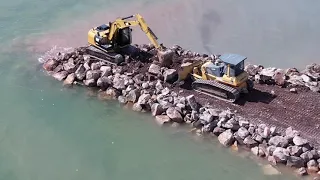 Great Team Work Of A Excavator and A Bulldozer Are Working Together For Dropping The Stone!