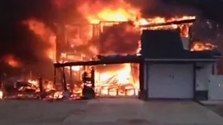 Fort McMurray firefighter watches his home burn down