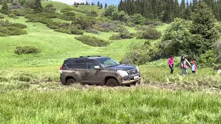 4x4 Adventures. Kazakhstan. Mountains. Toyota Land Cruiser Prado 150 in deep mud