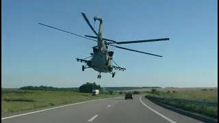 Helicopter Flying Between Cars