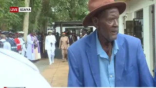 EMOTIONAL FRANCIS OGOLLA'S FATHER ARRIVES AT HIS SON'S GRAVE SITE FOR FINAL SEND-OFF.