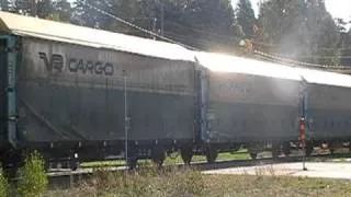 Freight train passes a level crossing at Loviisa, Finland