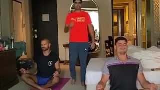 Shikhar Dhawan and Marcus Stoinis doing Yoga