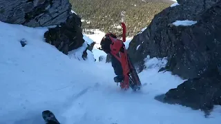 Climbing and rolling down a chute snowmobile (watch till the end)