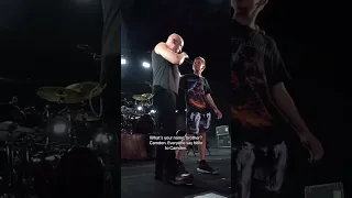 A fan joins Disturbed on stage. #shorts