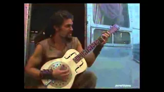 Jason Momoa playing guitar on set of Atlantis