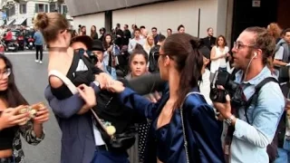 Model Gigi Hadid was manhandled ( video ) outside a Milan Fashion Week venue ( latest video )