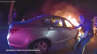 Hero cops save man from burning car