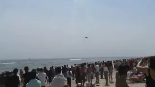 FA 18 super hornet breaks sound barrier on busy beach