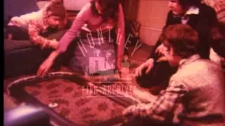 Family playing Scalextric, 1970's - Film 94282