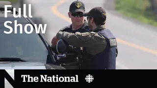 CBC News: The National | OPP officer killed, Alberta’s wildfire election, Migrant influx