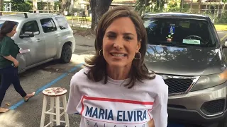 Maria Elvira Salazar courts voters at the Miami-Dade Auditorium voting precinct