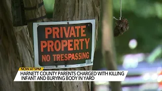 Parents arrested after infant's body found buried behind Erwin house