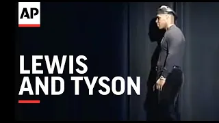 Boxers Lewis and Tyson involved in fight at presser.