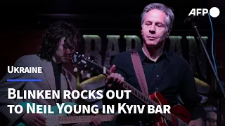 Blinken rocks out to Neil Young in Kyiv bar on visit to Ukraine | AFP